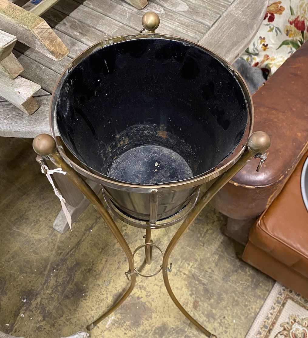 A mahogany and brass plant stand, height 104cm